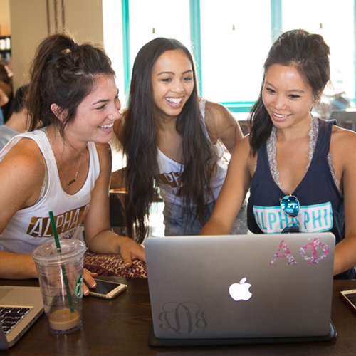 students looking at laptop